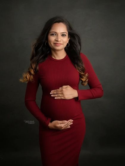 A classic solo maternity portrait. You look so radiant and confident, cradling your bump in this lovely red dress. A beautiful memory to cherish.