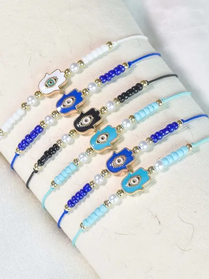 For a different take on protection, I also offer hamsa hand rakhis with delicate pearl and bead details.