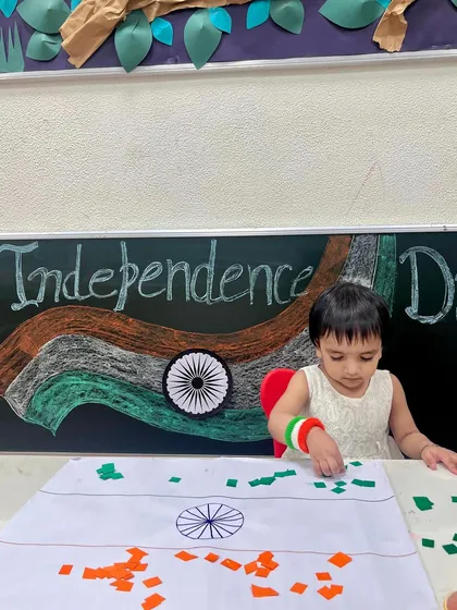 A sweet moment of focus as a child carefully places pieces of coloured paper to make our national flag. We make learning about our country a fun and hands-on experience.