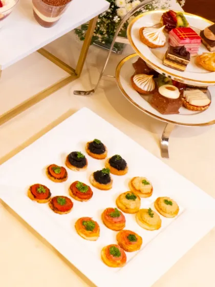A platter of exquisite petit fours and canapés from our collaboration with L'Opéra. These miniature desserts are perfect for a high-tea, offering a variety of refined flavours in a single bite.