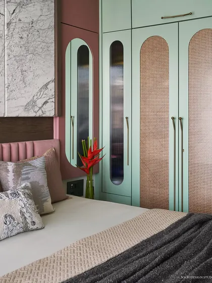 Another angle of the master bedroom, showing the relationship between the bed, headboard, and custom wardrobe.