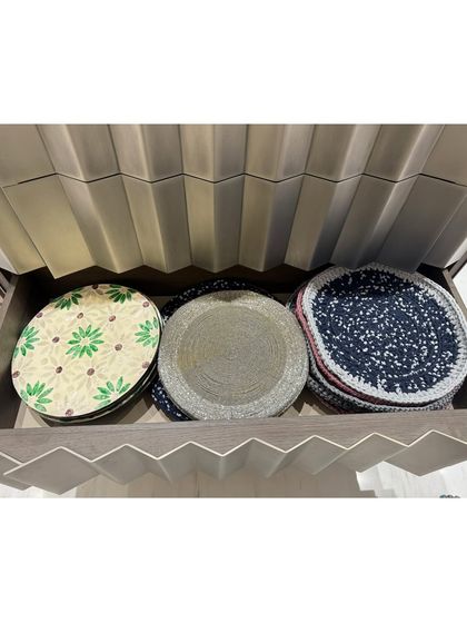 A drawer for placemats, showing how we file them for easy access. This keeps them flat and ready for use.