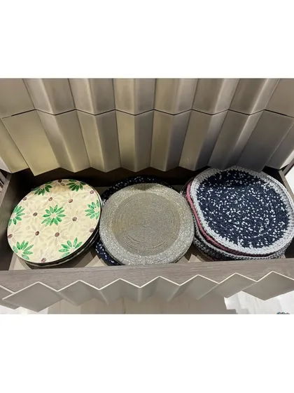 A drawer for placemats, showing how we file them for easy access. This keeps them flat and ready for use.
