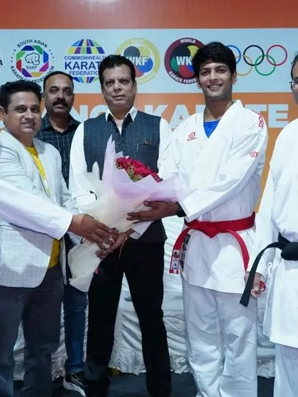 A moment of felicitation with an athlete at the Kumite seminar in Pune. We ensure our top athletes are present at these events to inspire the younger participants.