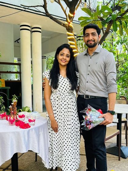 The couple posing by their beautifully decorated table. We take care of all the details so you can focus on making memories.