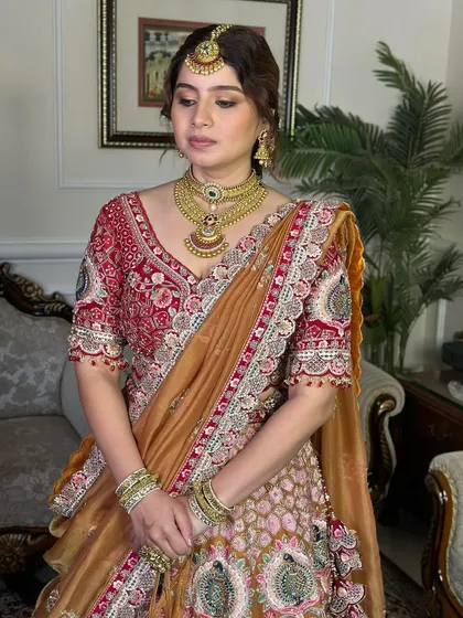 A quiet moment showing the beautiful details of her makeup and jewelry. The look is divine, timeless, and utterly captivating.