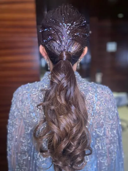 The back view of the glitter ponytail, showing how the sparkle catches the light. This is perfect for a cocktail party or reception.
