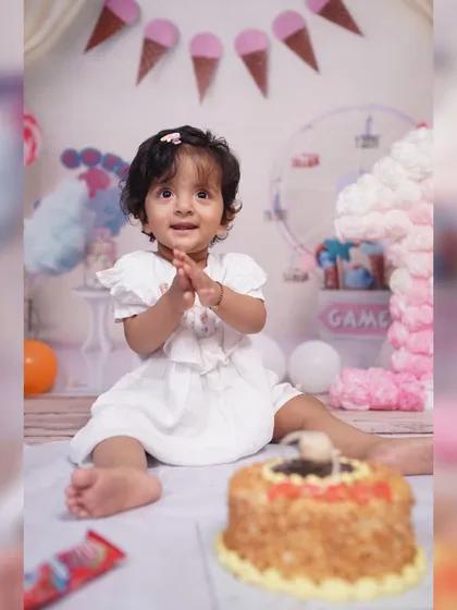 The cake smash moment in our Candy Land setup. The floor and backdrop are designed to be picture-perfect even during the messiest part of the celebration.
