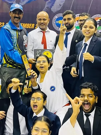 The sheer joy of victory. The entire team celebrates their collective success at the Bengal State Championship.