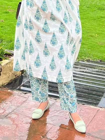 The details matter. This close-up shows the straight-fit printed pants and the hem of the kurta, a versatile set that is a must-have for your wardrobe.