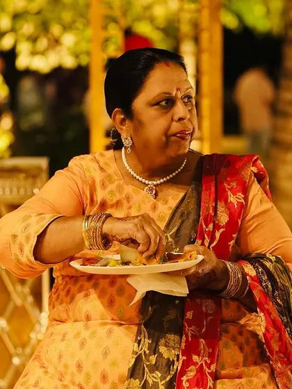A guest carefully selecting items from the buffet. I love seeing guests enjoy the spread I have prepared for them.