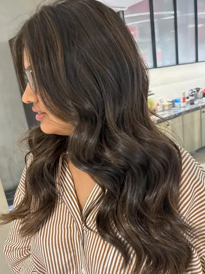 The client is thrilled with her first hair color experience. The no-bleach formula gave her a beautiful, natural-looking result.