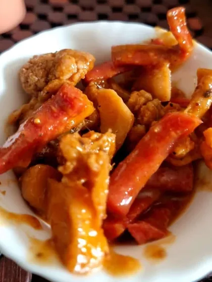 A serving of my Gajar Gobhi Shalgam pickle. You can see the tender chunks of vegetables coated in a rich, sweet and sour masala. It is perfect with parathas and mathris.