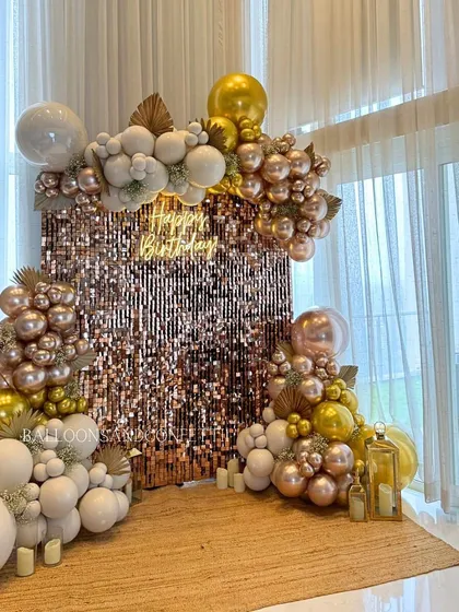 Bringing the glam with this rose gold and white birthday setup. The shimmer wall catches the light beautifully, while the mix of metallic and matte balloons adds texture and luxury. It’s the perfect spot for photos.