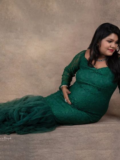 A relaxed, reclining pose in our emerald green lace gown. This is a great way to get a comfortable yet elegant shot during your session.