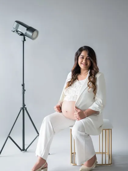 We even incorporated some of my studio lighting equipment into the shot for a fun, behind-the-scenes feel. This image celebrates her as a powerful woman, a mother-to-be, and the star of her own story.