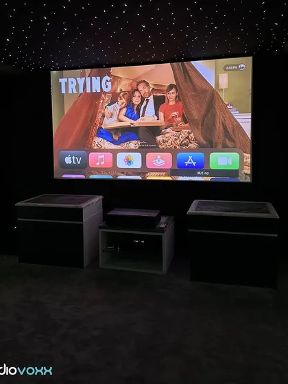 A view of the same four-seater theater, demonstrating the clarity and color accuracy of the projection system across different types of content.