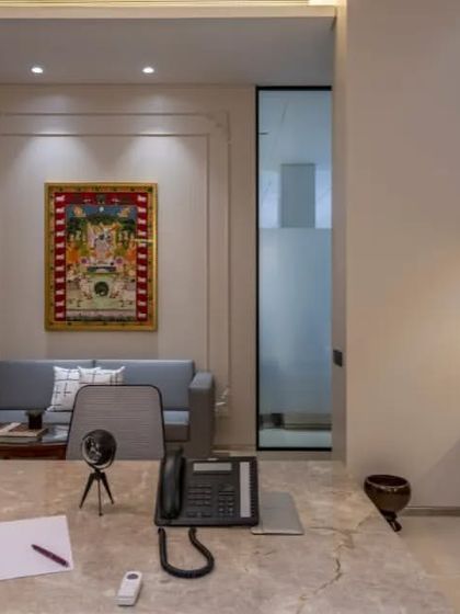 This cabin maintains a connection to the rest of the office through glass doors, promoting a sense of accessibility while still providing a private, focused environment for leadership.