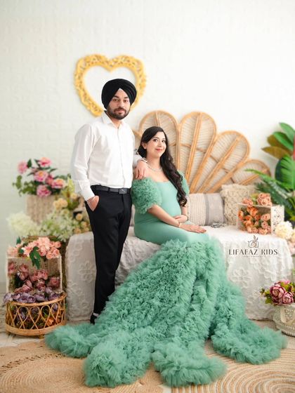 A formal portrait of the couple in our enchanting garden-themed set. This shot captures their loving bond in a beautifully styled, artistic environment.