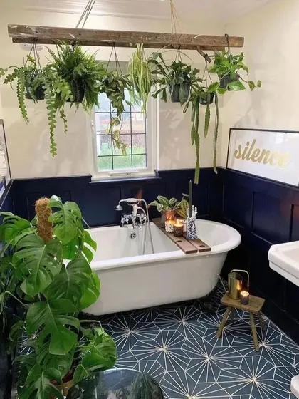 A bathroom is a warm, humid room that provides the perfect environment for many houseplants. This beautiful setup shows how you can create a green oasis in your bathroom.