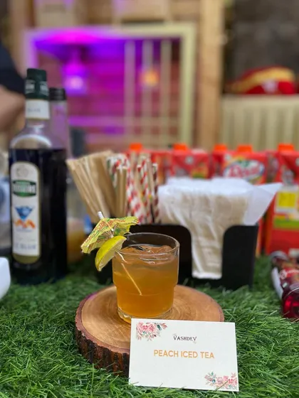 A cool and refreshing Peach Iced Tea, perfect for daytime events and summer gatherings.