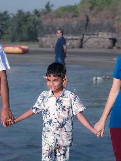 Another angle from the family beach walk, focusing on the connection as they all hold hands. These are the relaxed, happy memories I aim to preserve.