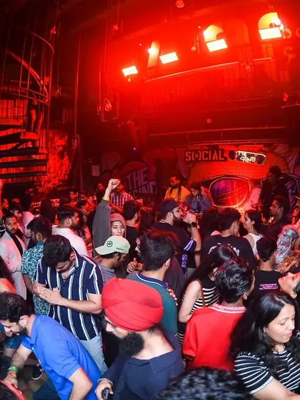 The whole club is lit up in red, creating an intense and immersive vibe.