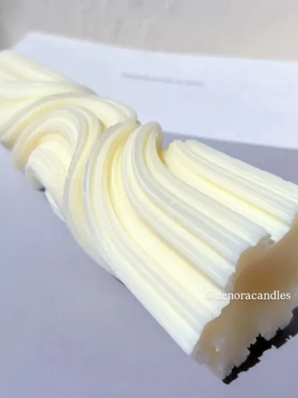 A close-up view of the texture and lines of the wave twisted candle.