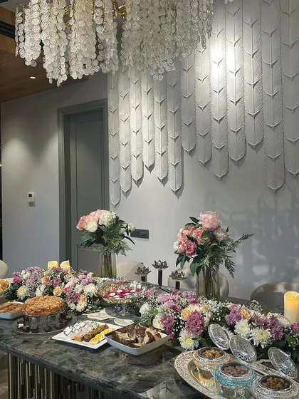 We decorated this dining table with a long floral runner and candles for a post satsang meal. It shows how we carry the festive theme throughout the house to create a cohesive experience for your guests.
