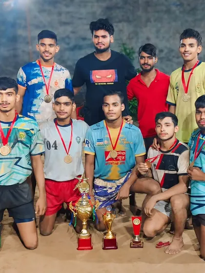 Our team celebrating a 1st position win at a Ghaziabad tournament on a mud court.