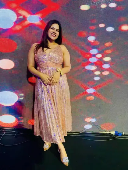 A moment to pose in my shimmery pink dress against a cool, colorful LED wall.