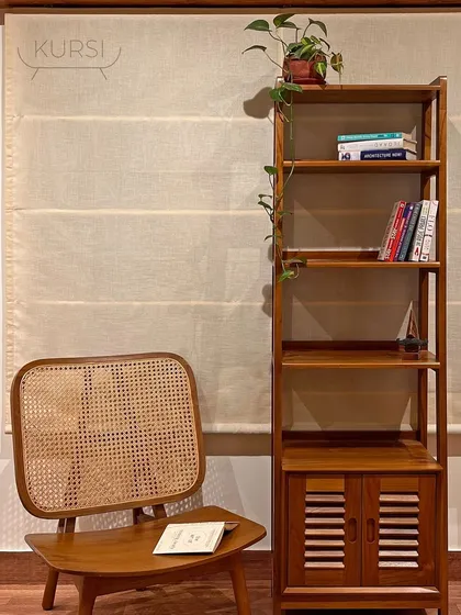 A custom teak wood bookshelf, designed with both open shelves and a lower cabinet with louvered doors. It’s a perfect piece for organizing and displaying your favorite books and objects.