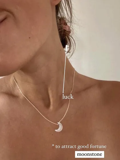 Another look at the 'ádhva' white moonstone Luna pendant, worn here to attract good fortune. It's a simple, elegant piece that carries the gentle energy of luck.
