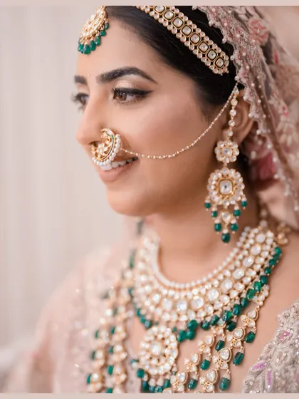 A bride's jewelry tells a story of heritage and personal style. I guided the selection of this intricate kundan and emerald set, ensuring it complemented the pastel Tarun Tahiliani outfit and completed a look of regal elegance.