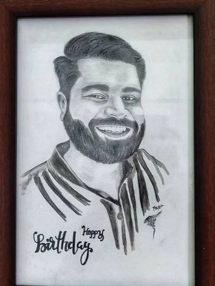 A hand-drawn portrait is one of the most personal gifts you can give. I added a custom "Happy Birthday" message to this framed charcoal sketch to make the occasion even more special.