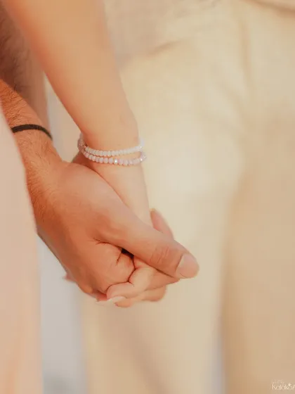 A simple touch can say everything. This close-up shot of the couple holding hands during their pre-wedding shoot in Lakshadweep captures the essence of their connection. It's a small detail that tells a big story.