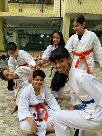 The bonds of friendship are forged in the dojo. This candid moment captures the fun and camaraderie that defines our karate family after a challenging class.