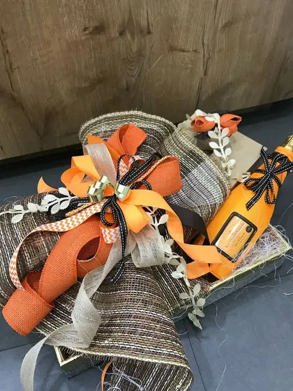A duplicate of ID 96, this image highlights the energetic and celebratory feel of our orange-themed bottle wrapping.