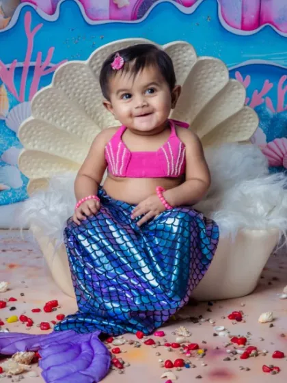 Our little mermaid making waves in cuteness. We have different tail colors to choose from.