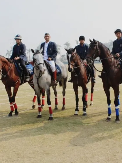 A team of our equestrians in formal attire, mounted and ready for an event, representing the discipline and professionalism of our academy.