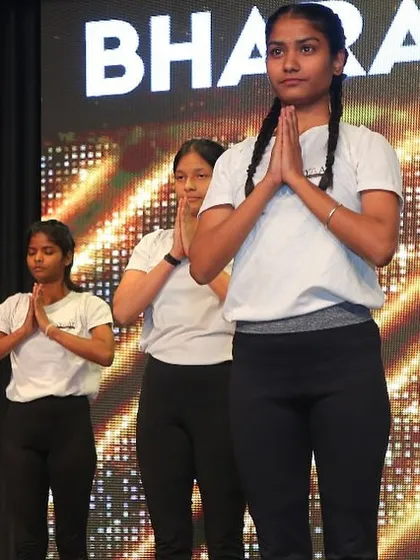 A moment of calm and respect with the Anjali Mudra (prayer hands) before starting our performance.