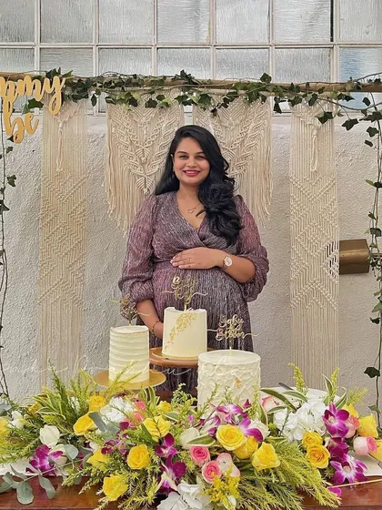 Celebrating a 'Mommy to be' is one of my favorite things. I designed this boho-chic baby shower with a beautiful macrame backdrop, a bamboo arch with fresh ivy, and a table filled with flowers and pretty cakes.