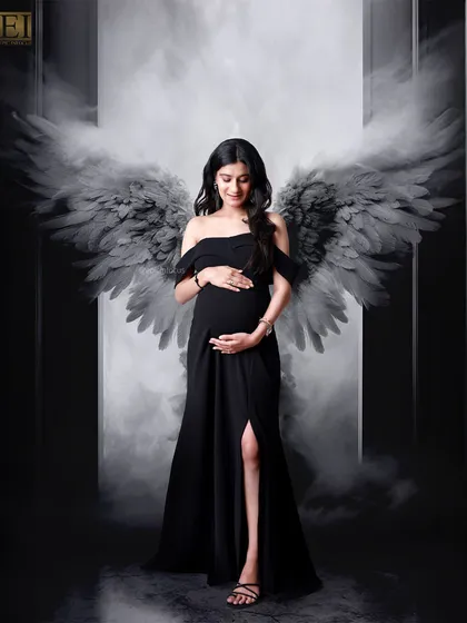 The drama of the angel wings theme is intensified in this striking black and white version of the portrait.