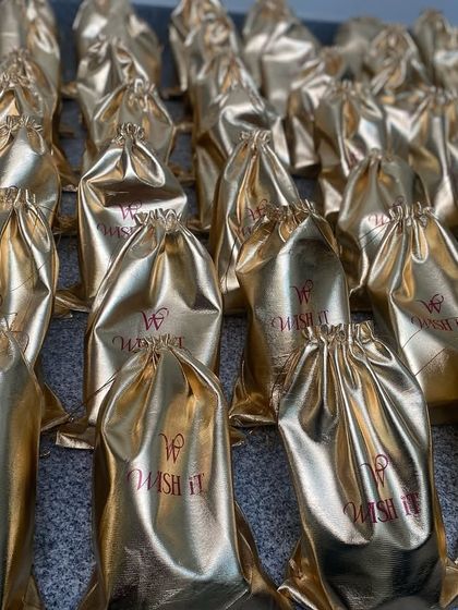 An army of golden potlis, ready to be packed for their journey to the US. We handle bulk international orders with the utmost care.
