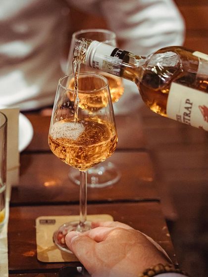 A guest enjoying a glass of rosé wine at our special event.