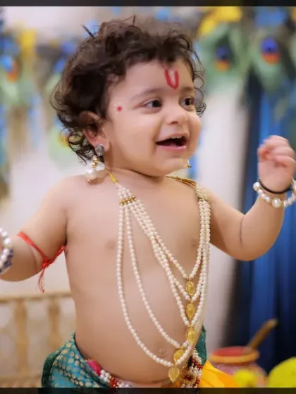 The pure, uninhibited joy of childhood captured in our Krishna-themed session. We aim for expressions that are both authentic and heartwarming.