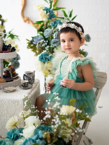 A close-up of the birthday girl enjoying her tea party.