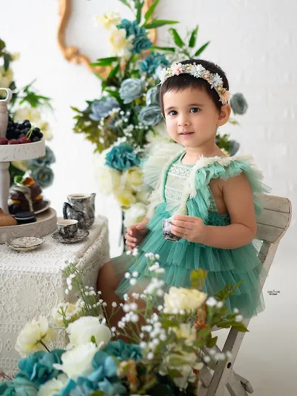 A close-up of the birthday girl enjoying her tea party.
