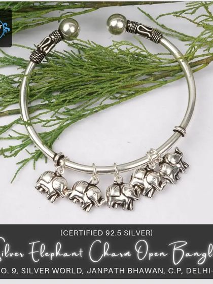 This silver open bangle is a beautiful piece of ethnic jewelry, featuring six dangling elephant charms. Elephants are a symbol of good luck and strength, making this a meaningful and stylish accessory.