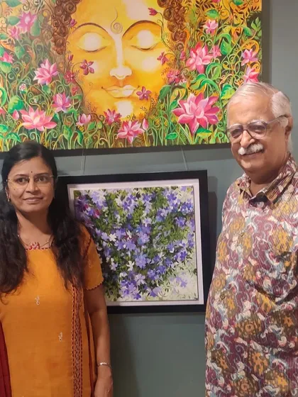 With a visitor at the Canvas Art Gallery exhibition, standing by my Lotus Buddha painting.